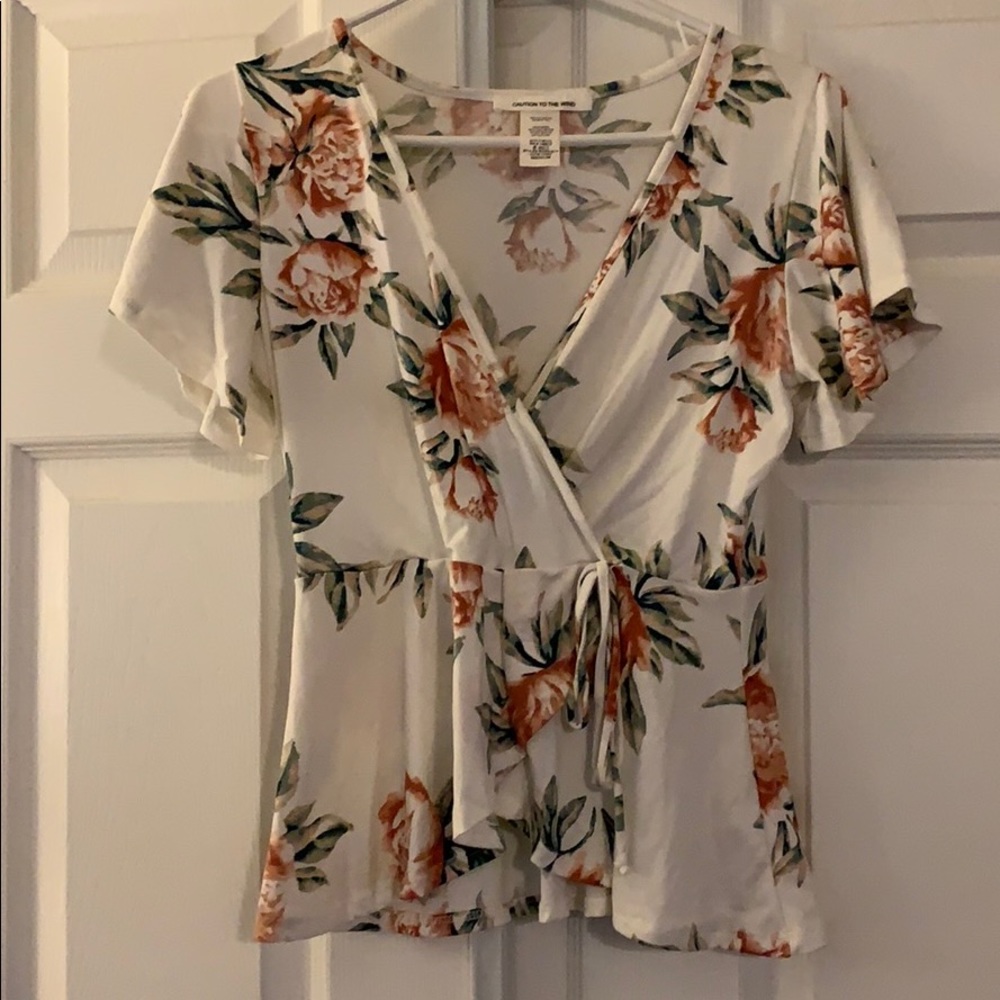 Soft floral wrap tee with tie detail.